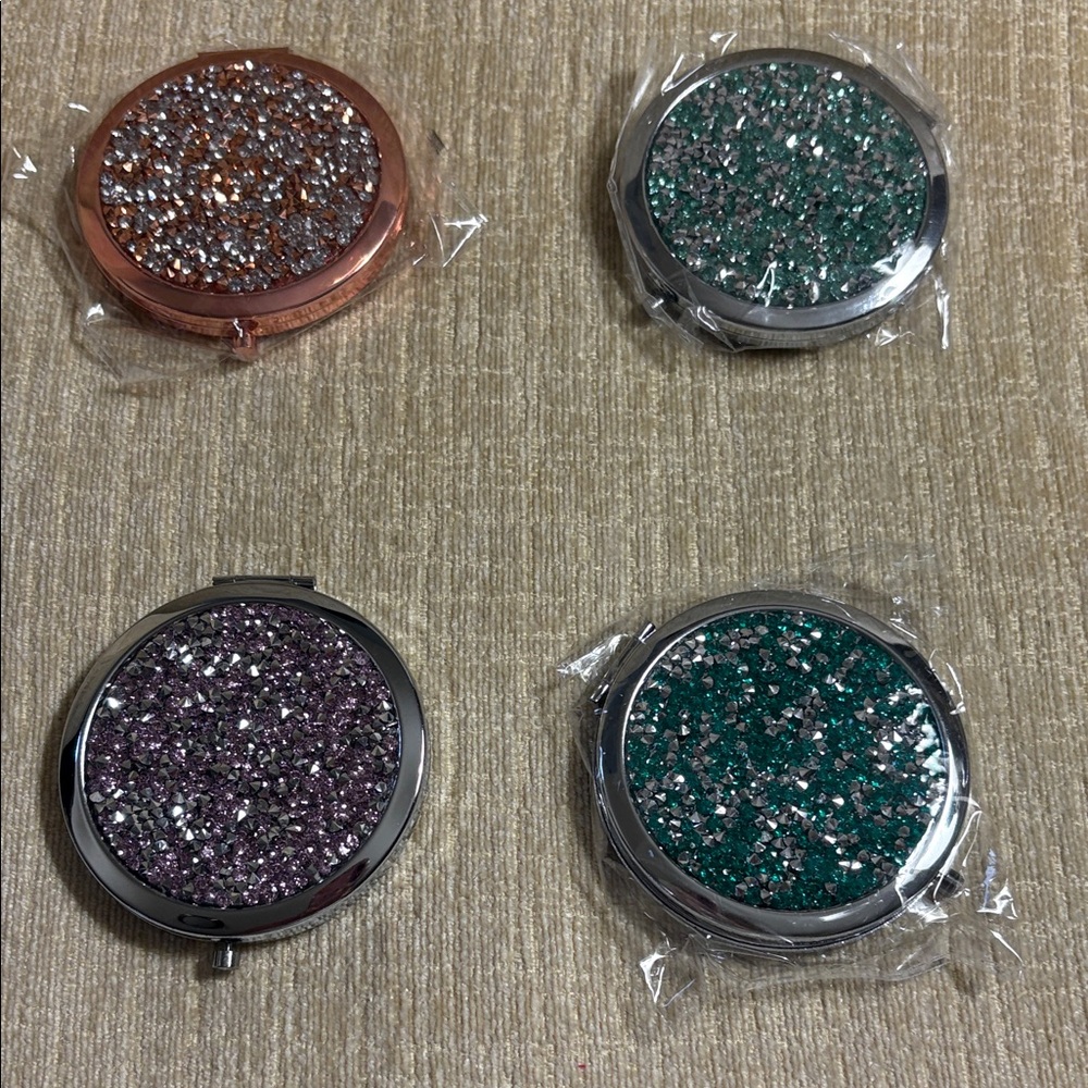 Sparkling Round Compact Magnifying Mirrors with colored rhinestones.